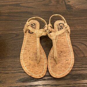 Nude patent leather sandals